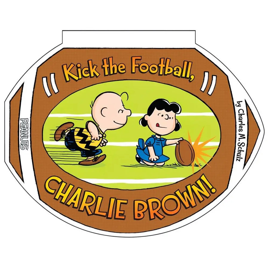 A Peanuts book cover or printed cover design featuring Charlie Brown and Snoopy on a football field, with the title text 'Kick the Football, Charlie Brown!' and 'Peanuts' visible on a football-shaped layout.