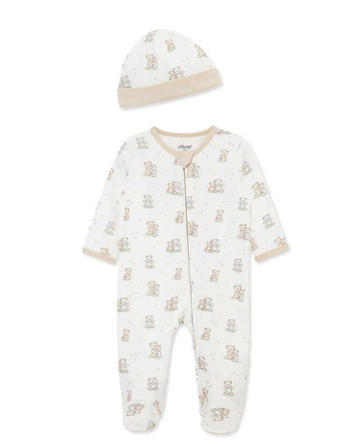 Baby onesie and hat set with teddy bear pattern on a white background