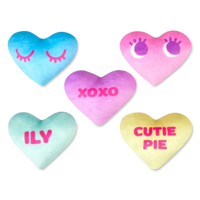 conversation hearts: 5 of them, each with a different design and saying. Cutie Pie, ILY, xoxo a happy face and a winking face