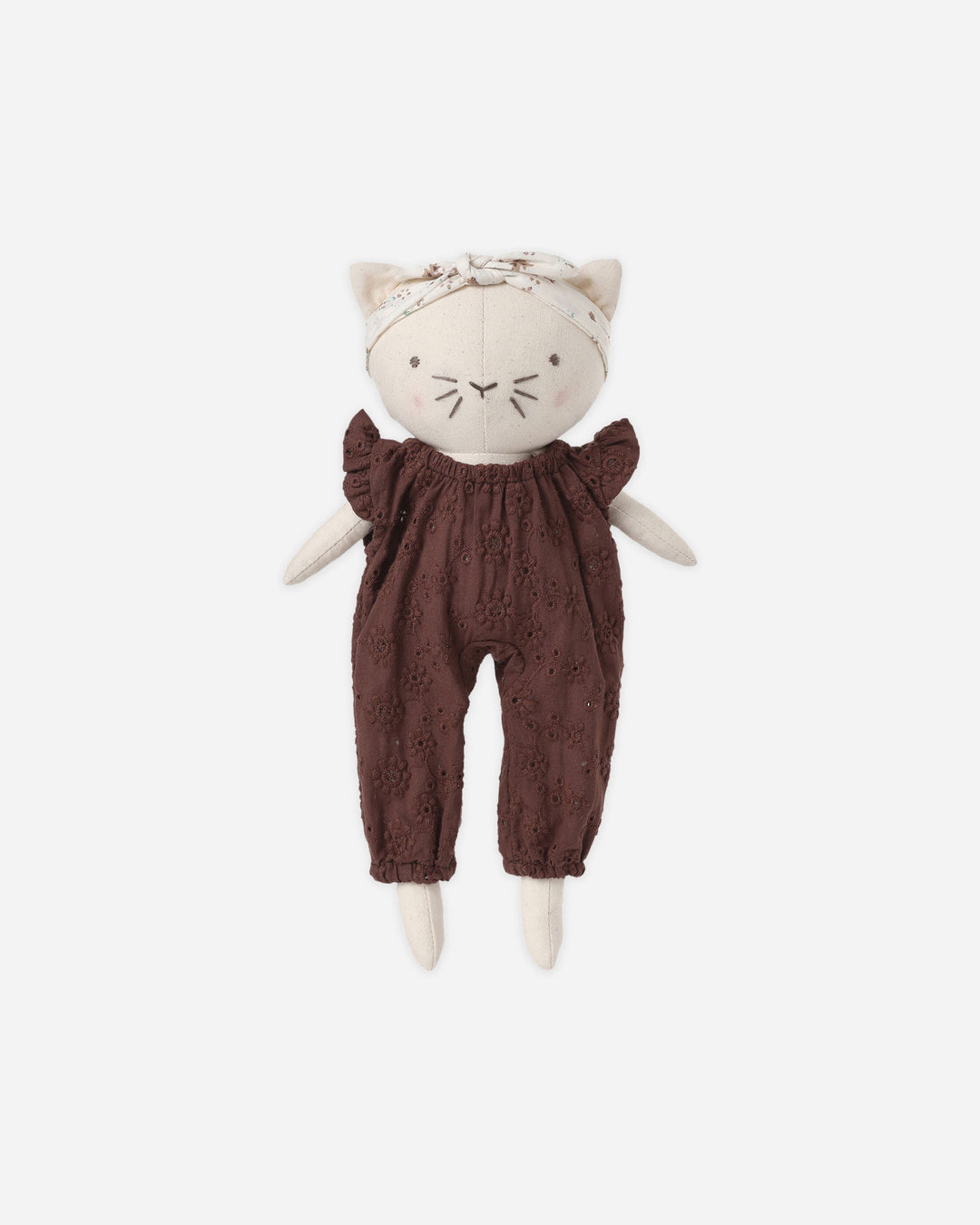 A plush cat doll with cream-colored fabric body, embroidered facial features, a matching cream headband with bow, and dark brown eyelet lace romper, centered on a light gray background.
