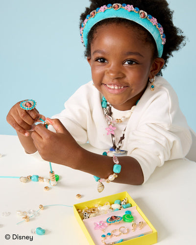 little girl modeling the jewelry with the elements from the kit. 