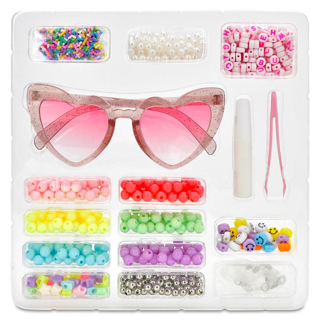 contents of DIY kit: Sunglasses, beads, sprinkles, tweezers 