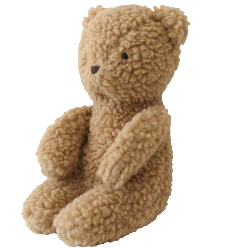 caramel colored sherpa teddy bear turned to the side slightly. 