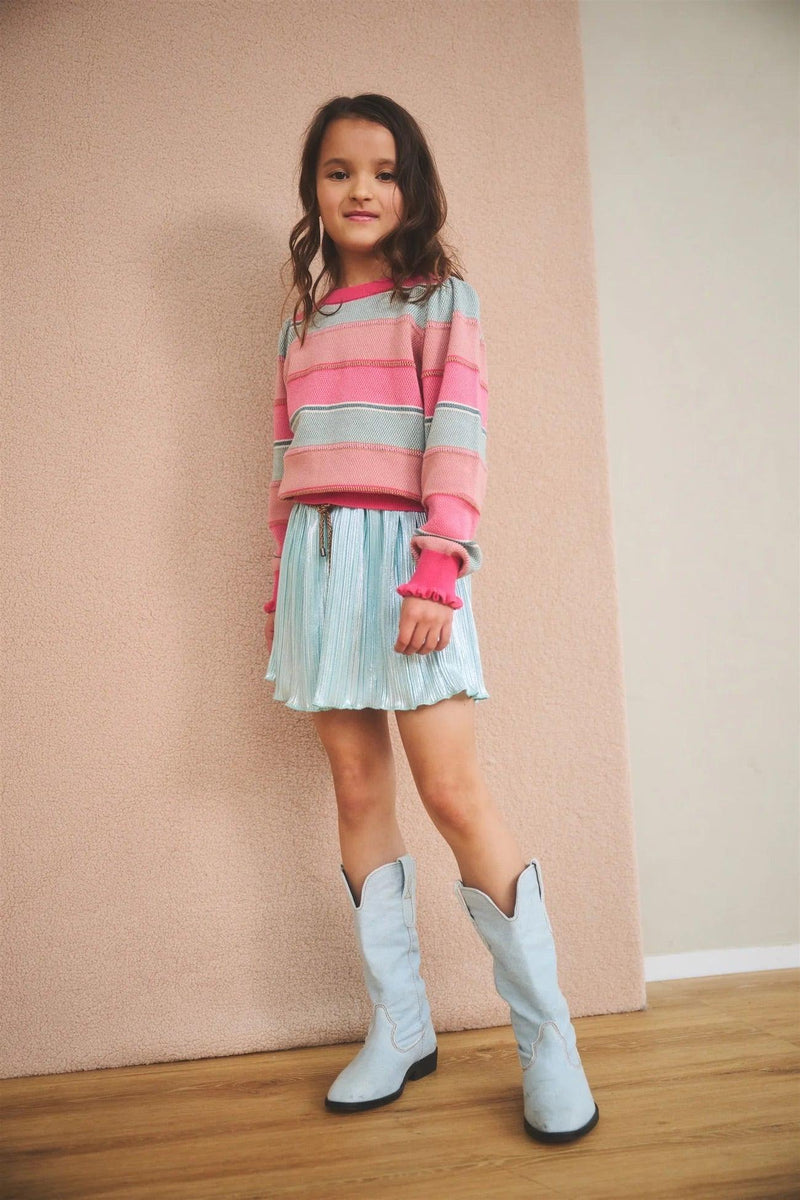 Girl wearing the Kamelie Striped Sweater from Like Flo with skirt and boots