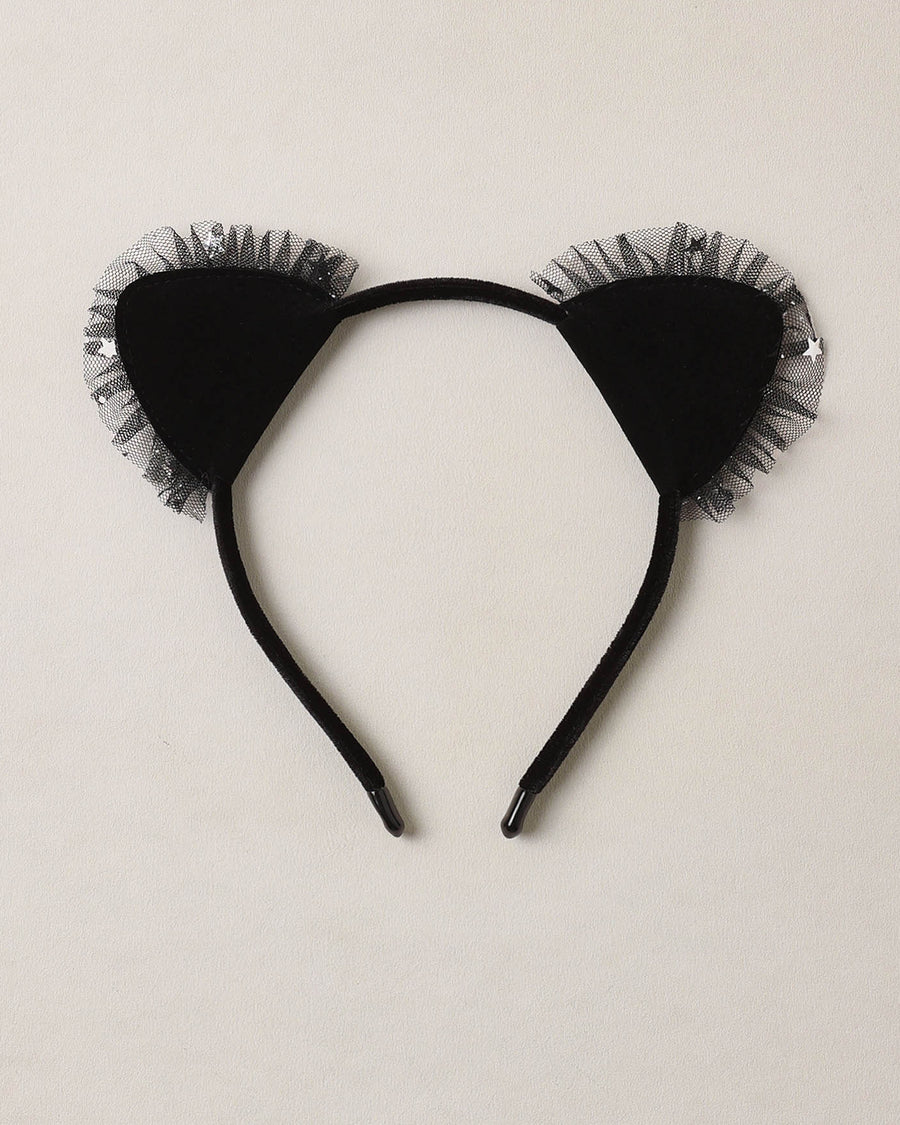 Black cat ear headband with tulle on a beige background