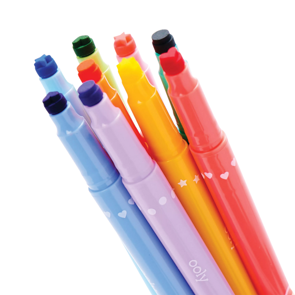 Set of colorful pens with heart designs on a white background