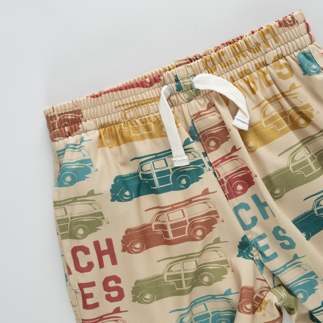 Children's shorts with vintage car pattern on a white background