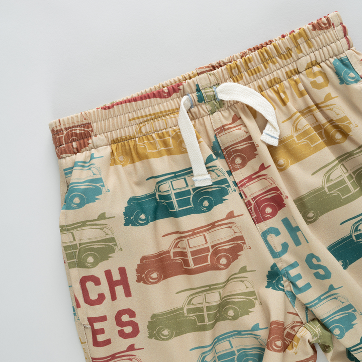 Children's shorts with vintage car pattern on a white background