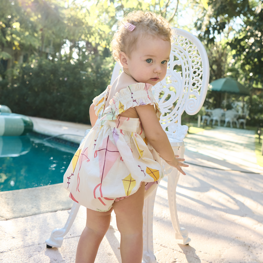 baby wearing the via syle bubble with a different print on it. 