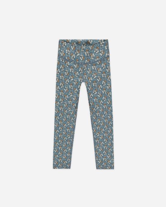 deep blue/teal legging with beige and copper floral design. wide waist band