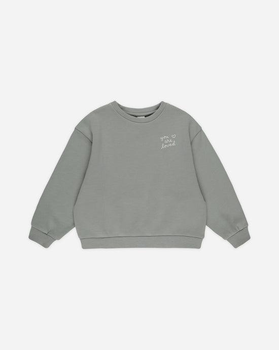 a greenish/gray colored sweatshirt with crew neck and long sleeves 