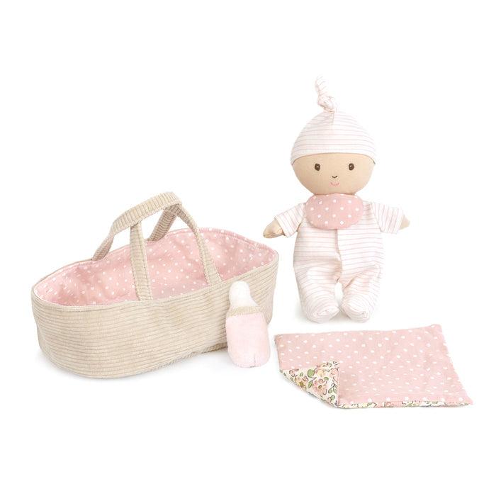 baby doll, bassinet, bottle and blanket in one play set. all colored in white, pink and beige with dots and stripes