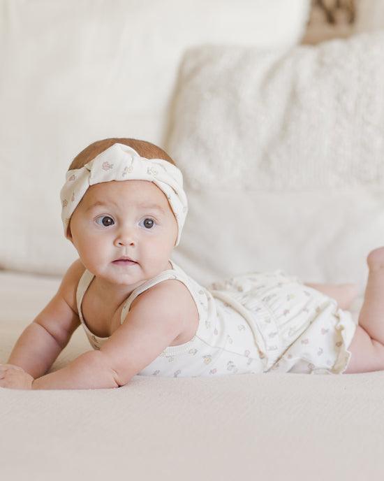 baby wearing the evie tank set with tank top and shorts with tiny pastel florals. 