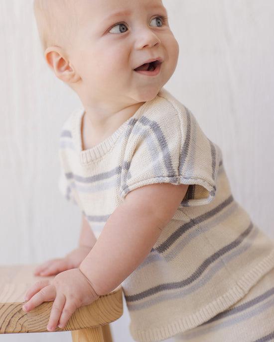 close up of the texture, pattern and style of sweater. 