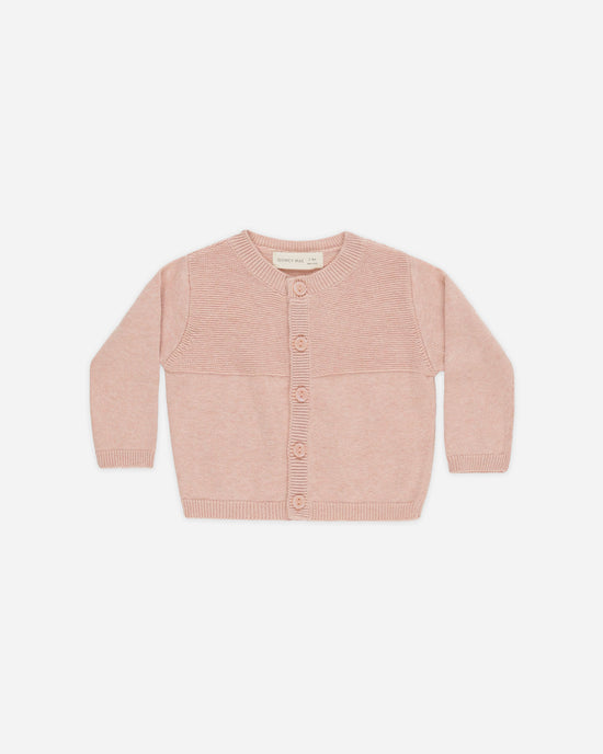 Pink baby cardigan on a white background