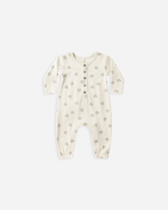 Baby onesie with a subtle bear pattern on a white background