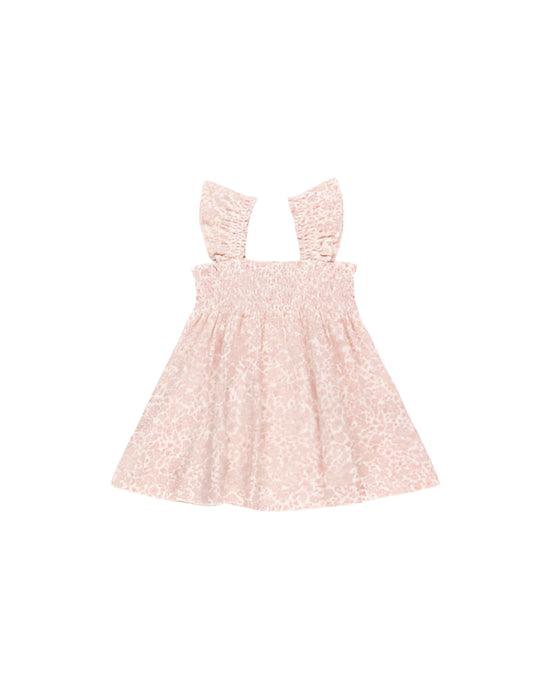 smocked top baby girl dress with light pink floral design on the dress. 