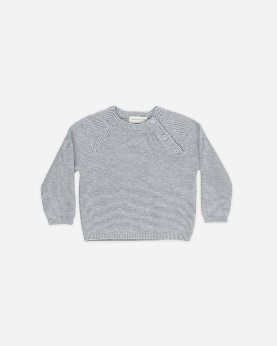 light blue sweater on a white background