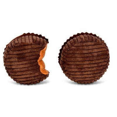 peanut butter cups loose out of the packaging, one round and one with a bite showing a peanut butter color inside. 