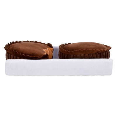 view of two peanut butter cups from the side. 