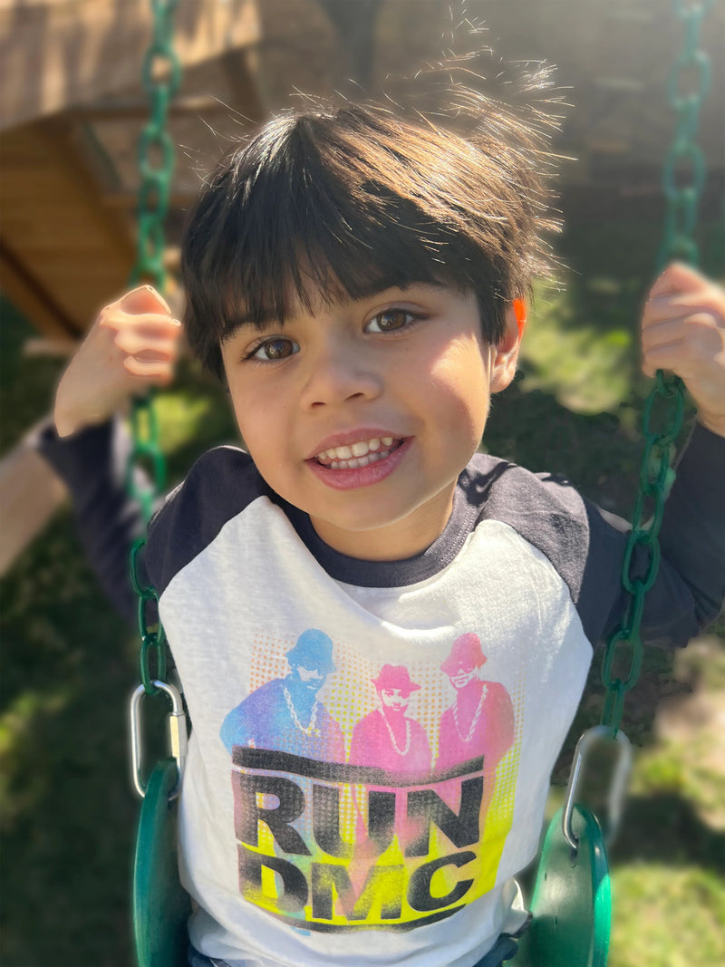 Boy wearing the Run DMC Raglan Tee from Rowdy Sprouts