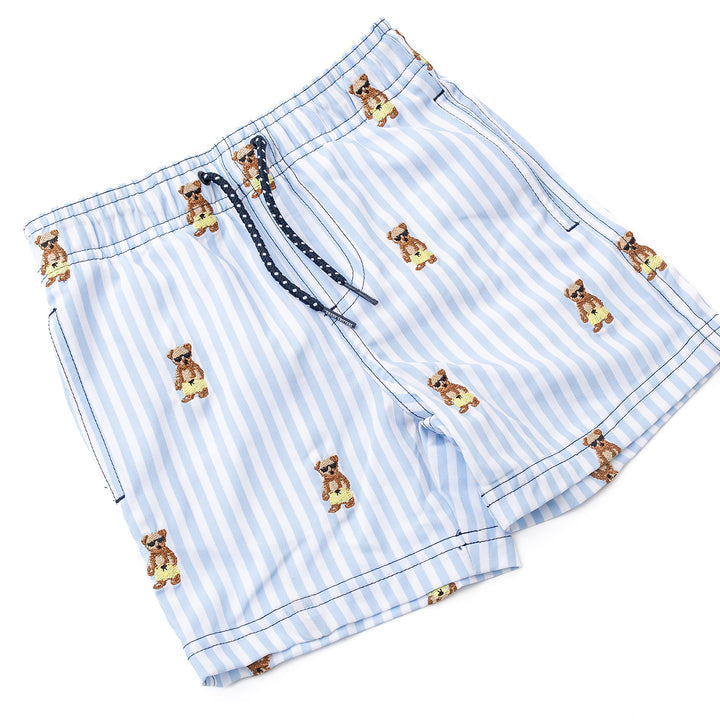 Blue and white striped shorts with teddy bear patterns on a white background