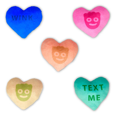 plush candy hearts, 3 with faces of the sour patch kids on it and two with sayings: Text me and wink . 