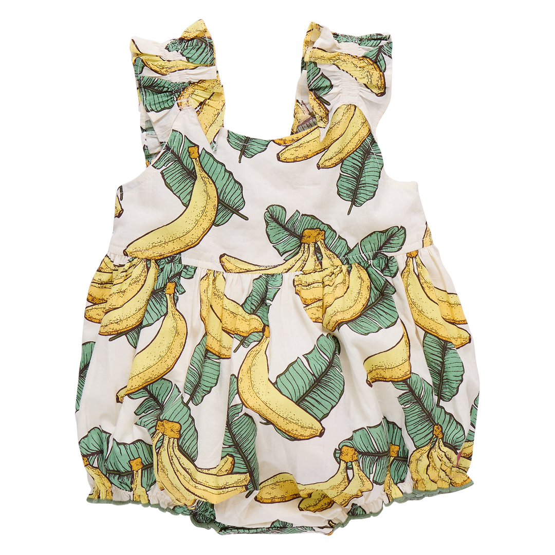 Baby romper with banana and leaf pattern on a white background