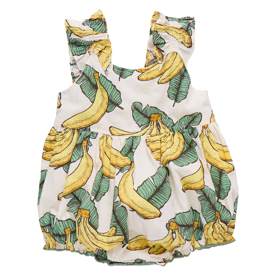 Baby romper with banana and leaf pattern on a white background