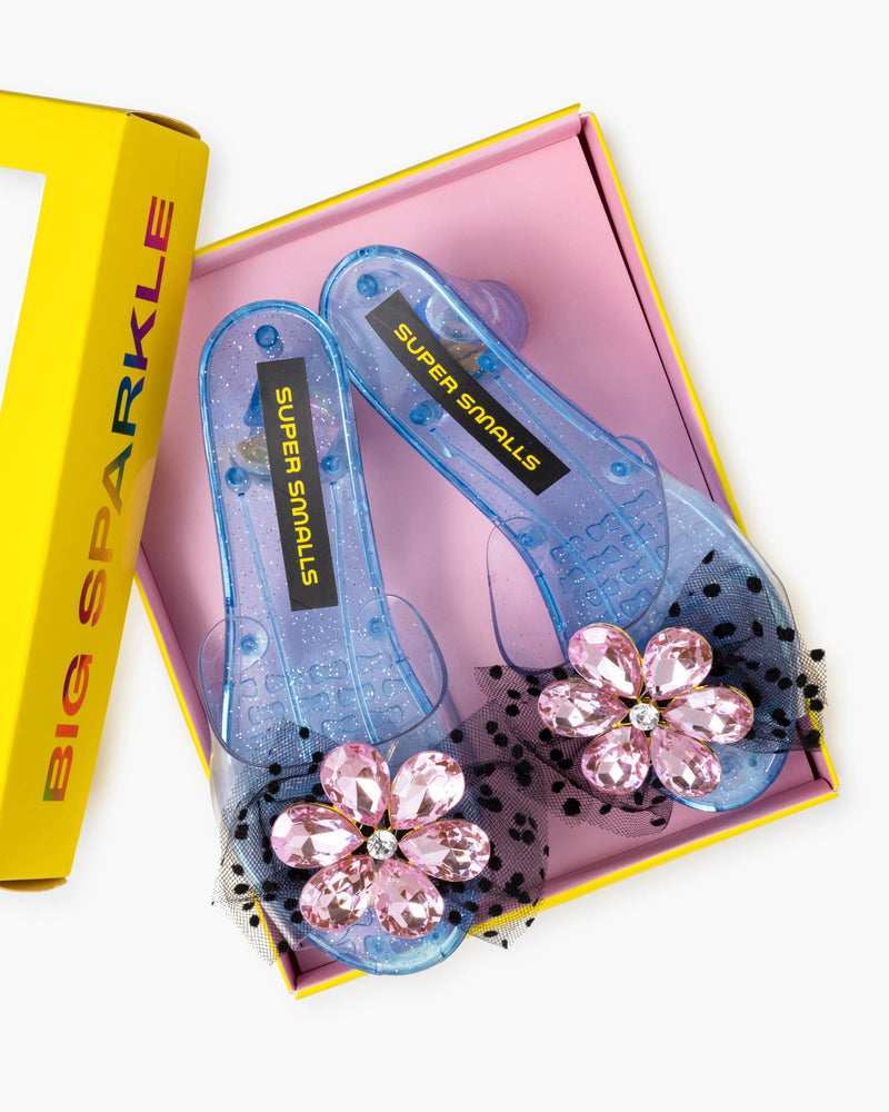 dress up shoes with blue base, pink rhinestone flower gem on the front with back tulle bow underneath the flower. 