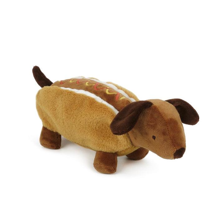plush dog that is dressed like a hot dog with ketchup and mustard 