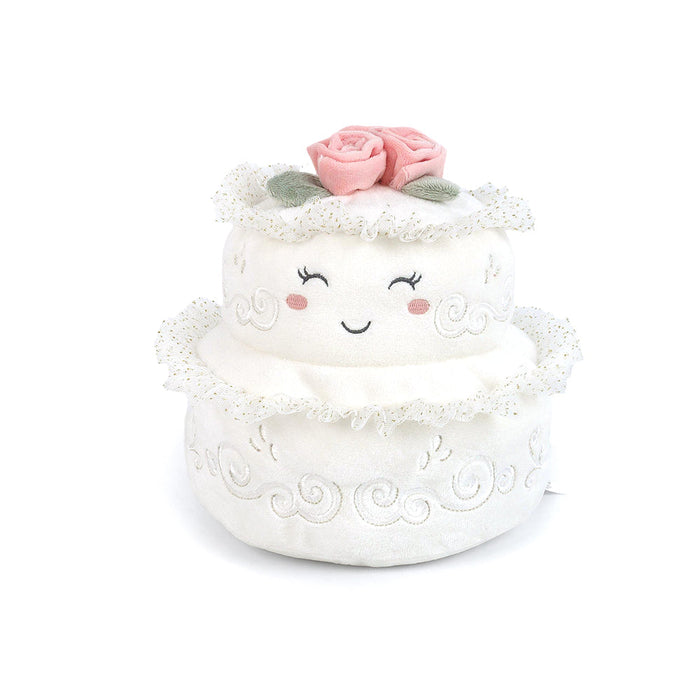 wedding cake plush toy, white in color with pink roses on the top