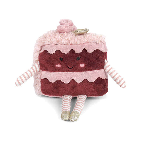Plush toy shaped like a slice of cake with pink frosting on a white background
