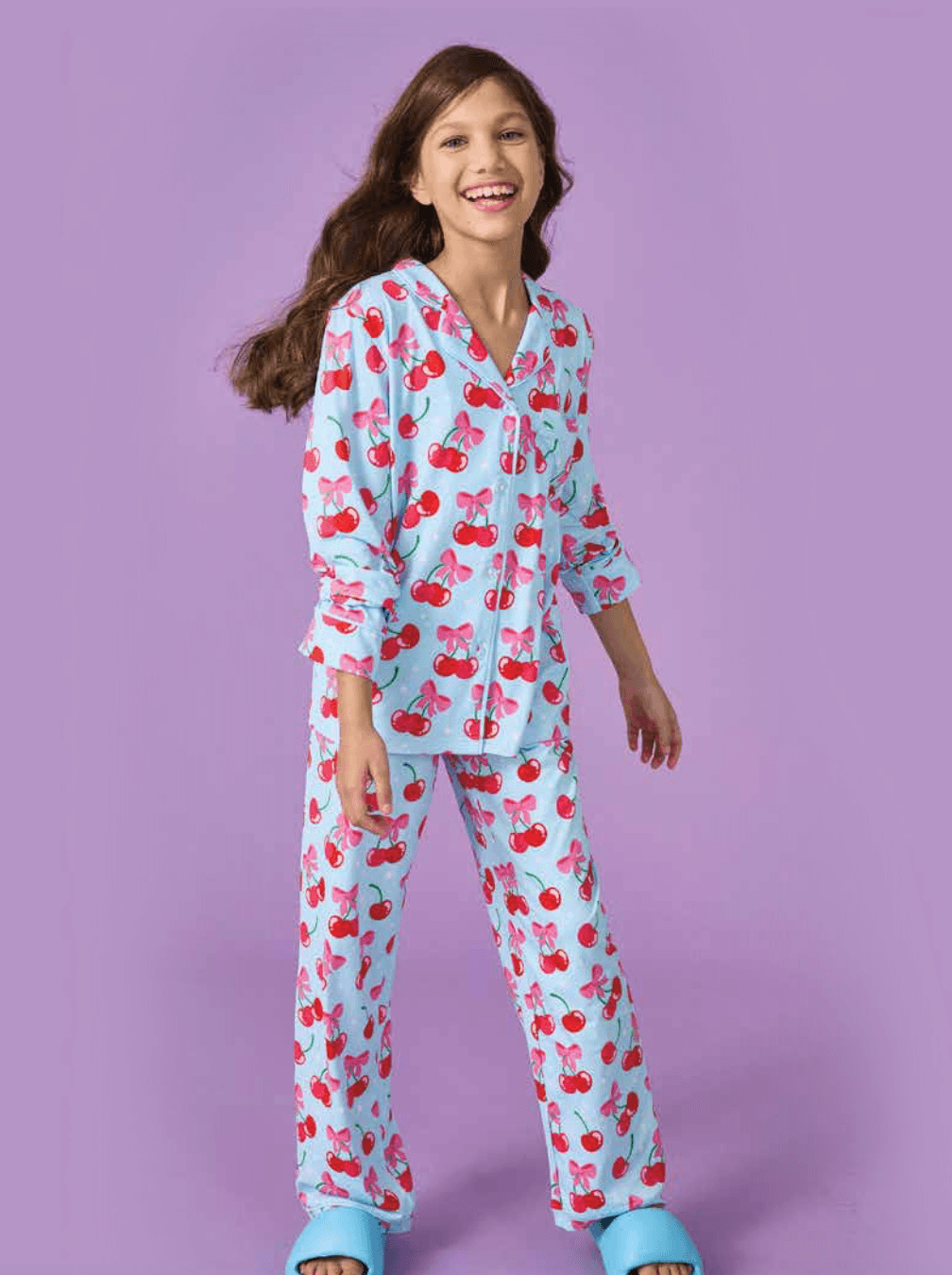 young girl modeling the cherry lounge set the top is longer and hits at the thigh