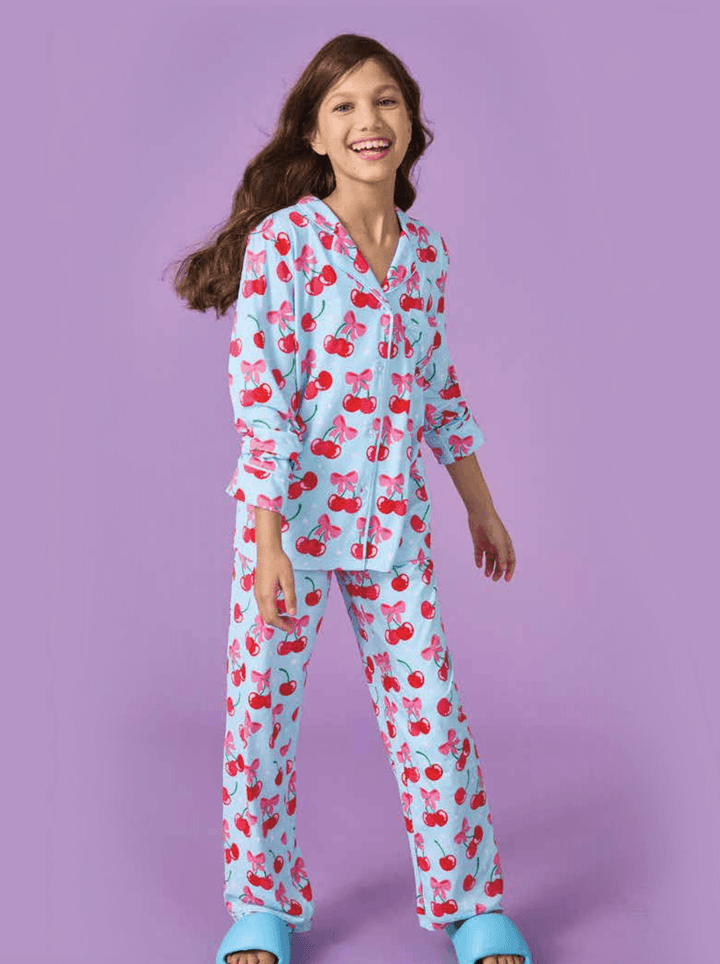 young girl modeling the cherry lounge set the top is longer and hits at the thigh