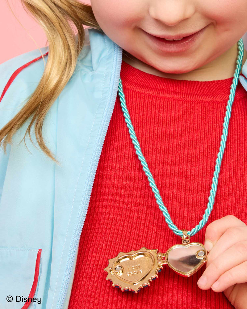 little girl modeling the moana locket on a turquoise cord 