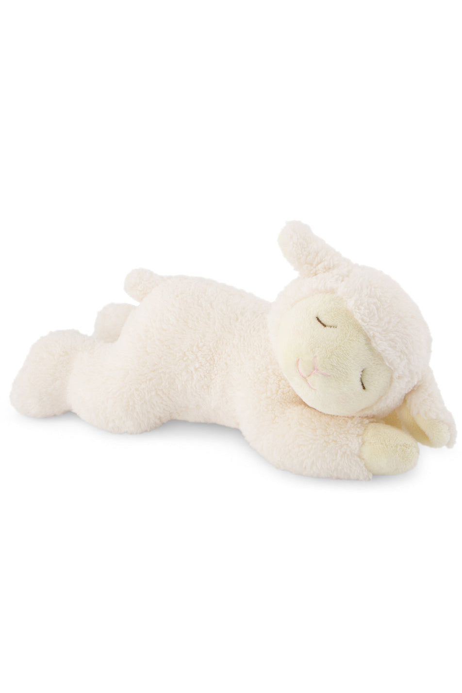 White plush lamb toy lying on a white background