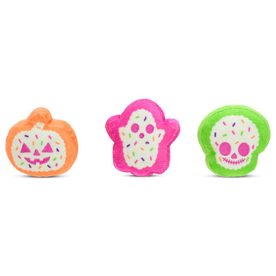 an up close look at the 3 cookies: ghost, pumpkin and skeleton. all of them brightly colored with sprinkles