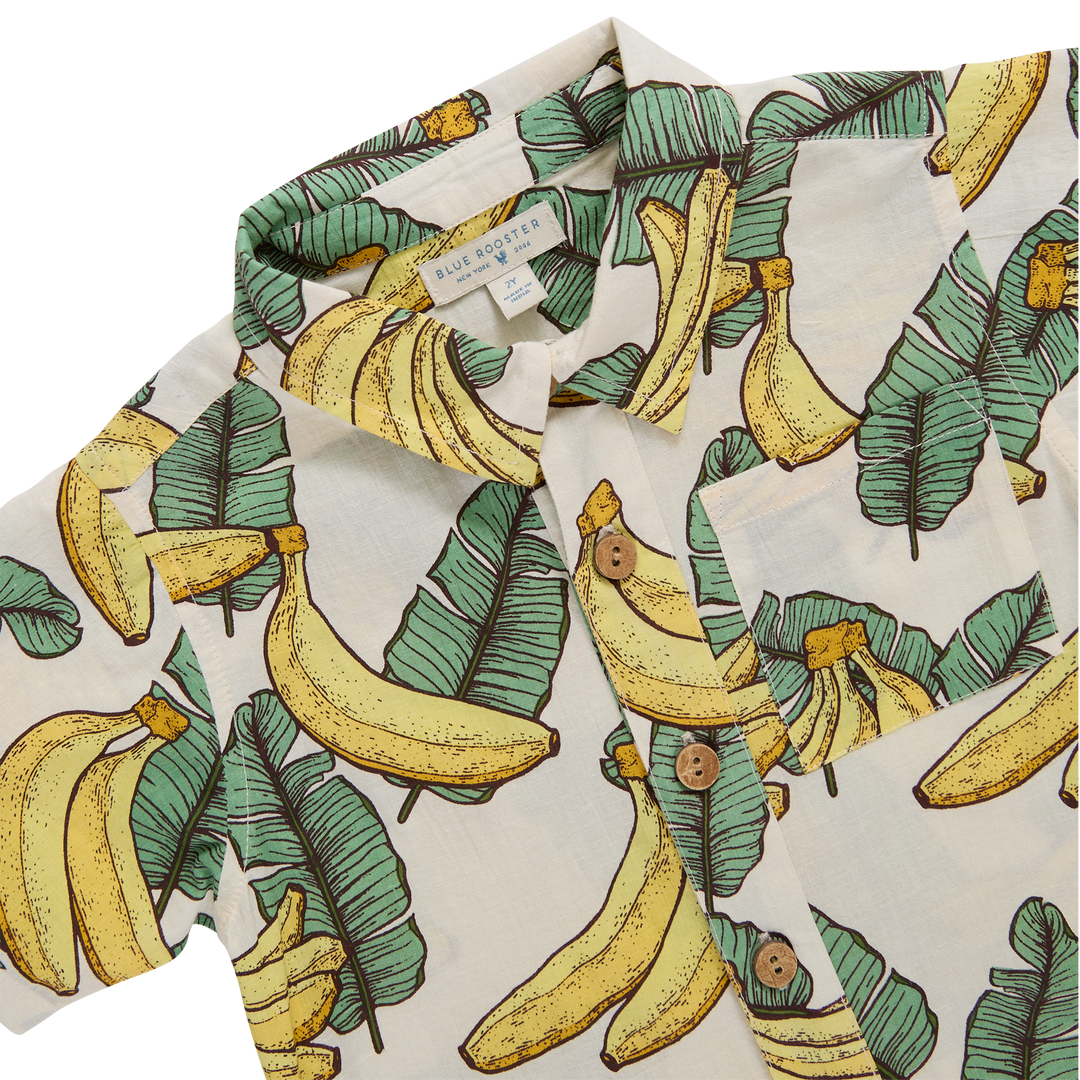 Shirt with banana and leaf pattern on a white background