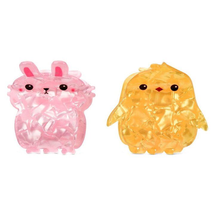 picture of small clips without the cardboard packaging. one small pink bunny and one small yellow chick. 
