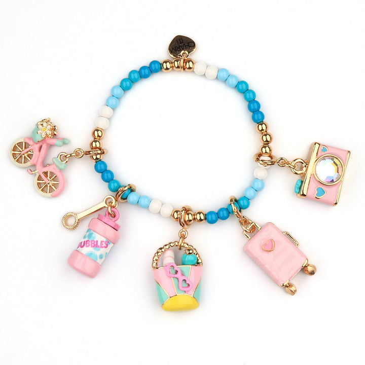 Colorful charm bracelet with various charms on a white background