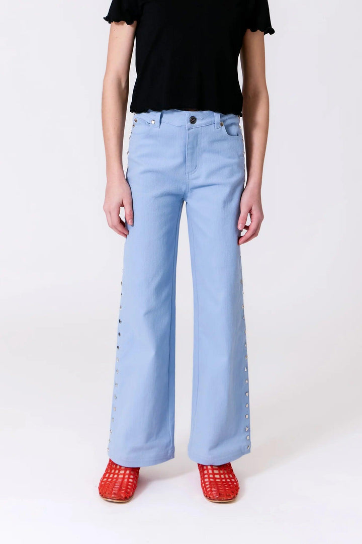 blue wide leg loose fit pants with studs along the sides. 