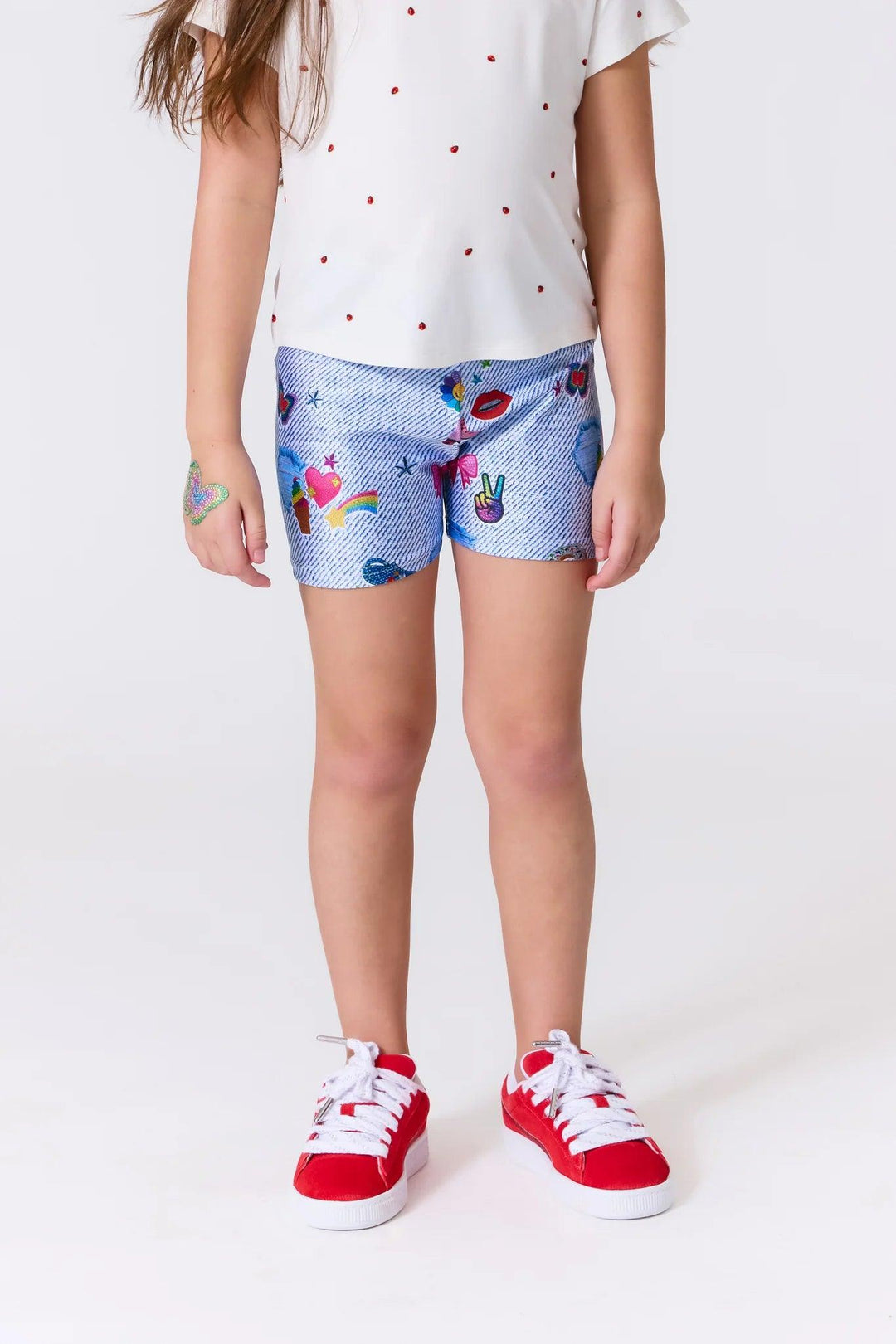 spandex girls shorts with sticker beans stickers on it as a print. colorful and fun shapes 