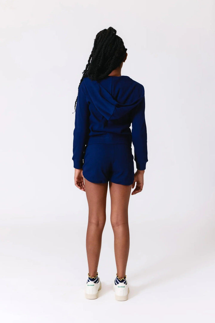 back of navy ribbed hoodie and matching shorts. 