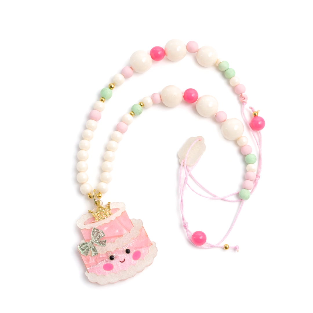 Necklace with a cute pink 3 tier birthday cake character pendant on a white background