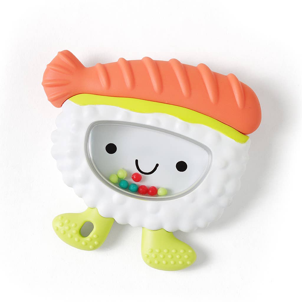 Colorful toy resembling a piece of sushi with a smiling face on a white background