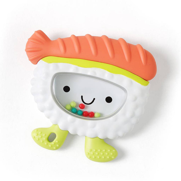 Colorful toy resembling a piece of sushi with a smiling face on a white background