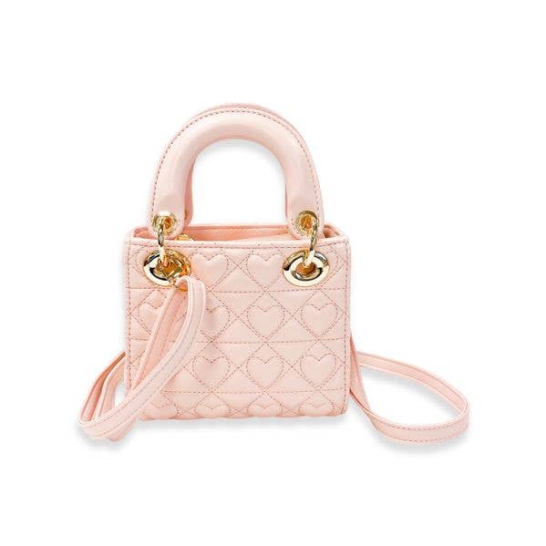 Pink quilted handbag with gold accents on a white background