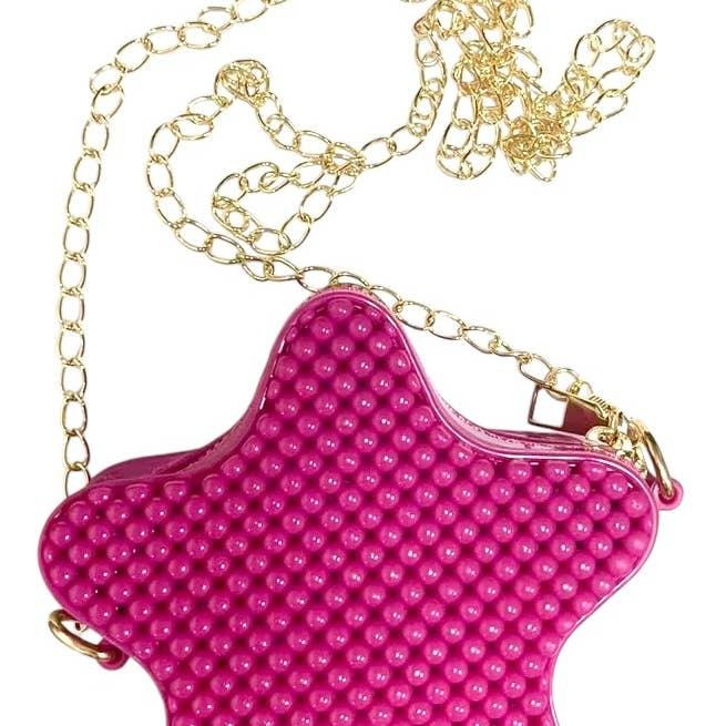 mini bubble crossbody bag in deep pink . gold chain crossbody. 