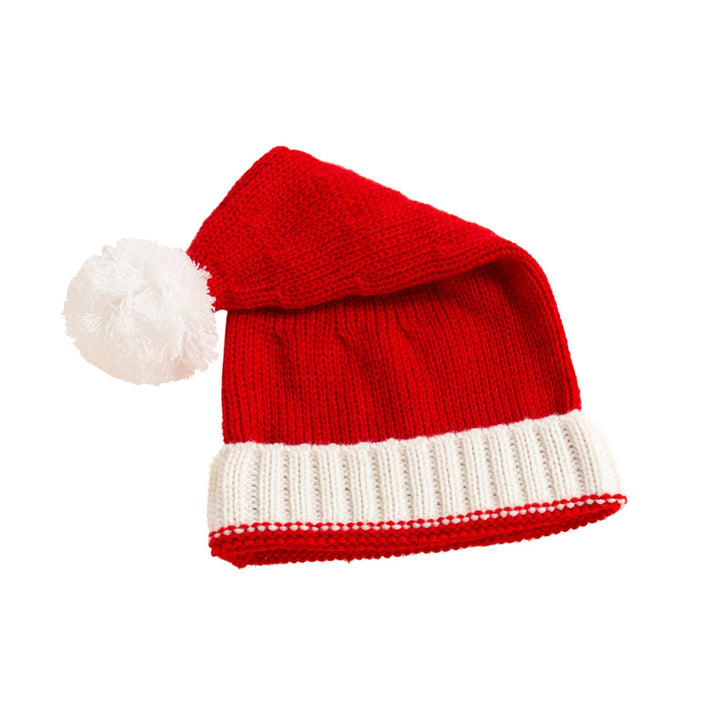 Red and white knitted Santa hat with a white pom-pom on a white background